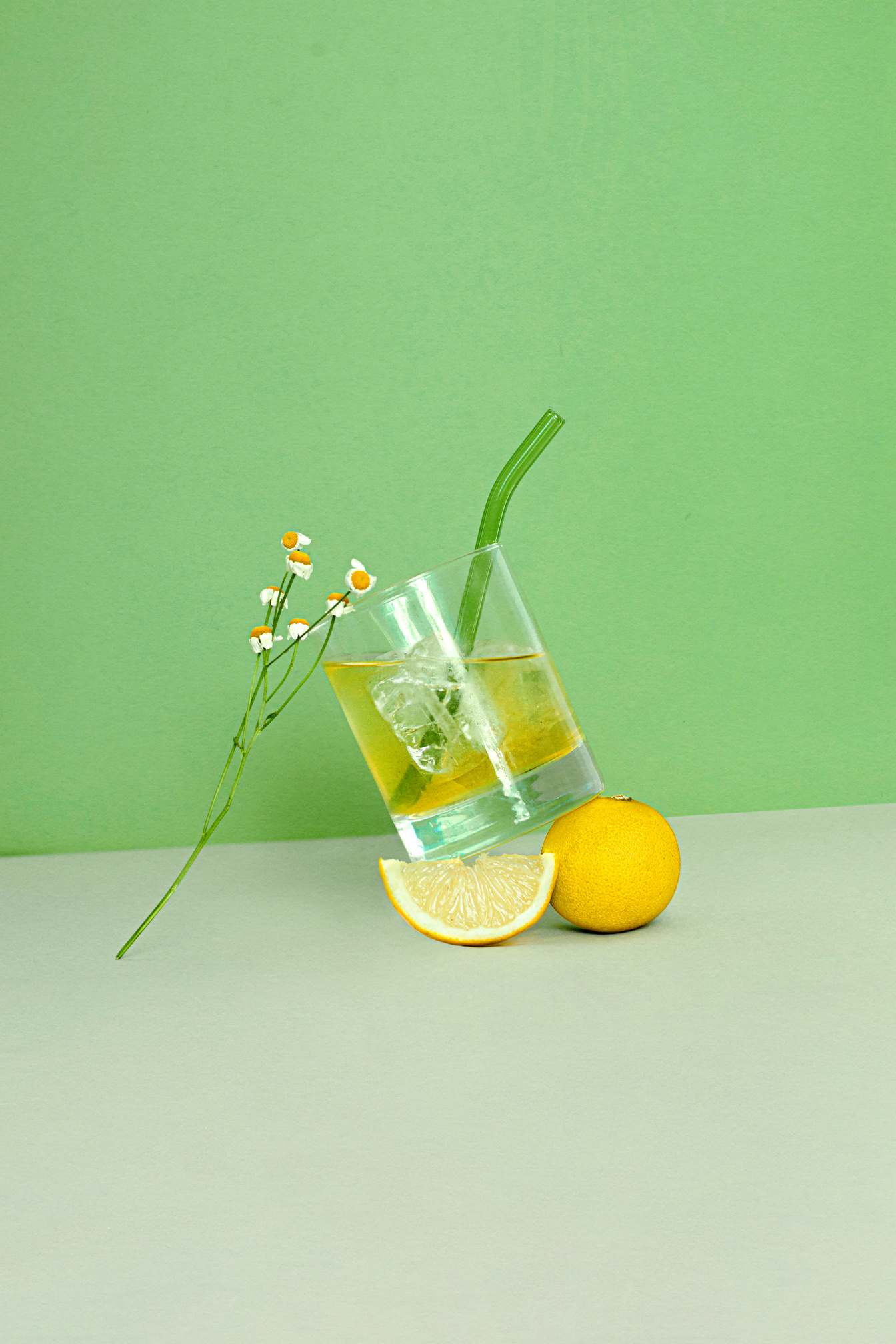 Iced Herbal Tea on Green Background